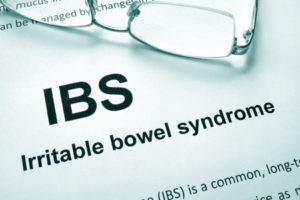 60526867 - paper with words irritable bowel syndrome (ibs) and glasses.