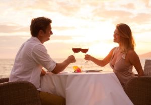 28878070 - couple sharing romantic sunset dinner on the beach